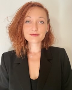 Ilaria Venagli is looking into the camera with a faint smile.